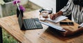 shot of female accounting bookkeeper providing accounting service for small businesses, woman using digital tablet and Royalty Free Stock Photo