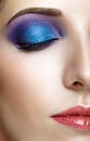 Shot of female half face with closed eye and violet - blue make Royalty Free Stock Photo