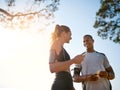 Buddy up for the best. Shot of a fit young couple working out together outdoors. Royalty Free Stock Photo