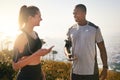 Have you got your running playlist ready. Shot of a fit young couple working out together outdoors. Royalty Free Stock Photo