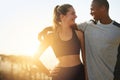Keeping each other healthy and happy. Shot of a fit young couple working out together outdoors. Royalty Free Stock Photo
