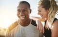 Partners in life and fitness. Shot of a fit young couple working out together outdoors. Royalty Free Stock Photo