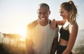 Shes my greatest fitness motivator. Shot of a fit young couple working out together outdoors. Royalty Free Stock Photo
