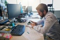 Reading an important message. Shot of a focused young businessman texting on his cellphone while being seated behind his Royalty Free Stock Photo