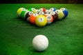 Shot of foot pool balls standing on green table. Royalty Free Stock Photo