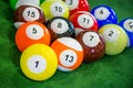 Shot of foot pool balls standing on green table.