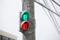 Shot of a frozen traffic light with blue sky and electrical wires in background. Increase in the number of accidents on Royalty Free Stock Photo