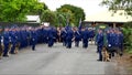 Shot of a funeral with police, dogs, motocycles