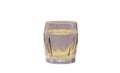 A shot glass containing liquid on a white background