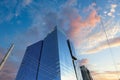 A shot of a glass skyscraper in the skyline with a blue sky and powerful red clouds at sunset in downtown Atlanta Royalty Free Stock Photo