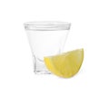 Shot glass of vodka and lemon isolated on white Royalty Free Stock Photo