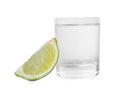 Shot glass of vodka and lime isolated on white Royalty Free Stock Photo
