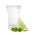 Shot glass of vodka, mint and lime isolated on white Royalty Free Stock Photo