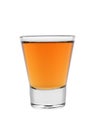 Shot glass whiskey or brandy, close-up. Isolated on a white background Royalty Free Stock Photo