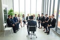 Shot of a group of businesspeople having a discussion in seminar at office