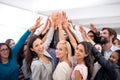 High five for business success. Shot of a group of businesspeople raising their hands in a huddle. Royalty Free Stock Photo