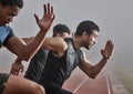 Just a little bit further. Shot of a group of male athletes participating in a race.