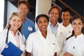 We never fail to deliver. A shot of a group of medical professionals smiling at the camera. Royalty Free Stock Photo