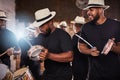 Keeping up with the beat. Shot of a group of musical performers playing together. Royalty Free Stock Photo