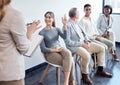 Please raise your hand when you hear your name. Shot of a group of new employees having a discussion with the recruiter Royalty Free Stock Photo