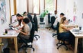 A small office filled with big dreams. Shot of a group of young businesspeople working together modern office. Royalty Free Stock Photo