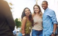 It was a day to remember. Shot of a group of young friends having their picture taken outdoors. Royalty Free Stock Photo