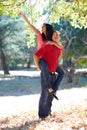 Having outdoor fun together. Shot of a handsome young man giving his girlfriend a piggyback ride in the park. Royalty Free Stock Photo