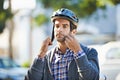 Strap in for safety. Shot of a handsome young man preparing to take a ride by putting on a helmet. Royalty Free Stock Photo