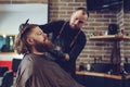 Shot of happy barber with client.