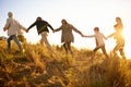 Safe in each others hands. Shot of a happy family holding hands on a morning walk together.