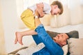 Nothing builds a bond like play time. Shot of a happy little boy having fun with his father at home. Royalty Free Stock Photo