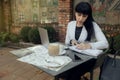 Confident businesswoman wearing casual clothes and using a laptop while working online. Online work concept Royalty Free Stock Photo