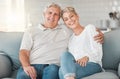 Were definitely two of a kind. Shot of a happy senior couple relaxing on the sofa at home.