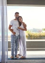 Weve waited all week for this. Shot of a happy young couple enjoying their morning coffee together on the balcony at Royalty Free Stock Photo