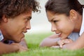We see eye to eye. Shot of a happy young couple gazing into each others eyes on the lawn. Royalty Free Stock Photo