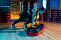 Shot of healthy young woman in black sportswear using step platform at gym. Aerobic and fitness exercises. Royalty Free Stock Photo