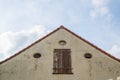 Shot of a house  front with an old door and blue sky Royalty Free Stock Photo