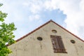 Shot of a house  front with an old door and blue sky Royalty Free Stock Photo