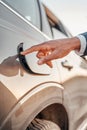 Shot of human hand opening fuel tank of car Royalty Free Stock Photo