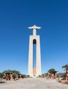 Shot of the iconic Cristo Rei statue in Lisbon, Portugal with a blue sky in the background
