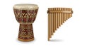 Djembe drum with intricate patterns and a pan flute close together. Royalty Free Stock Photo