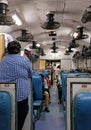 A shot from inside of a non-AC chair car based railway coach in India.