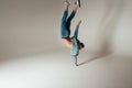 Shot of jump feet up, jump, stand on one`s hands, of mad, crazy, cheerful, successful, lucky guy in casual outfit, jeans, jumping