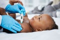 Youll be just fine. Shot of a little baby having her temperature taken by a doctor with a thermometer. Royalty Free Stock Photo