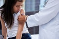 It'll be all better soon. Shot of a little girl getting a vaccination by a doctor in a hospital. Royalty Free Stock Photo