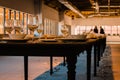 Shot of the long table that is set with dishes and many have fallen and broken Royalty Free Stock Photo