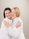 Shot of loving adult mother and daughter hugging