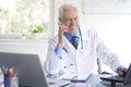 Male doctor making call Royalty Free Stock Photo