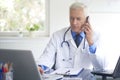 Male doctor making call Royalty Free Stock Photo