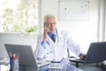 Male doctor making call Royalty Free Stock Photo